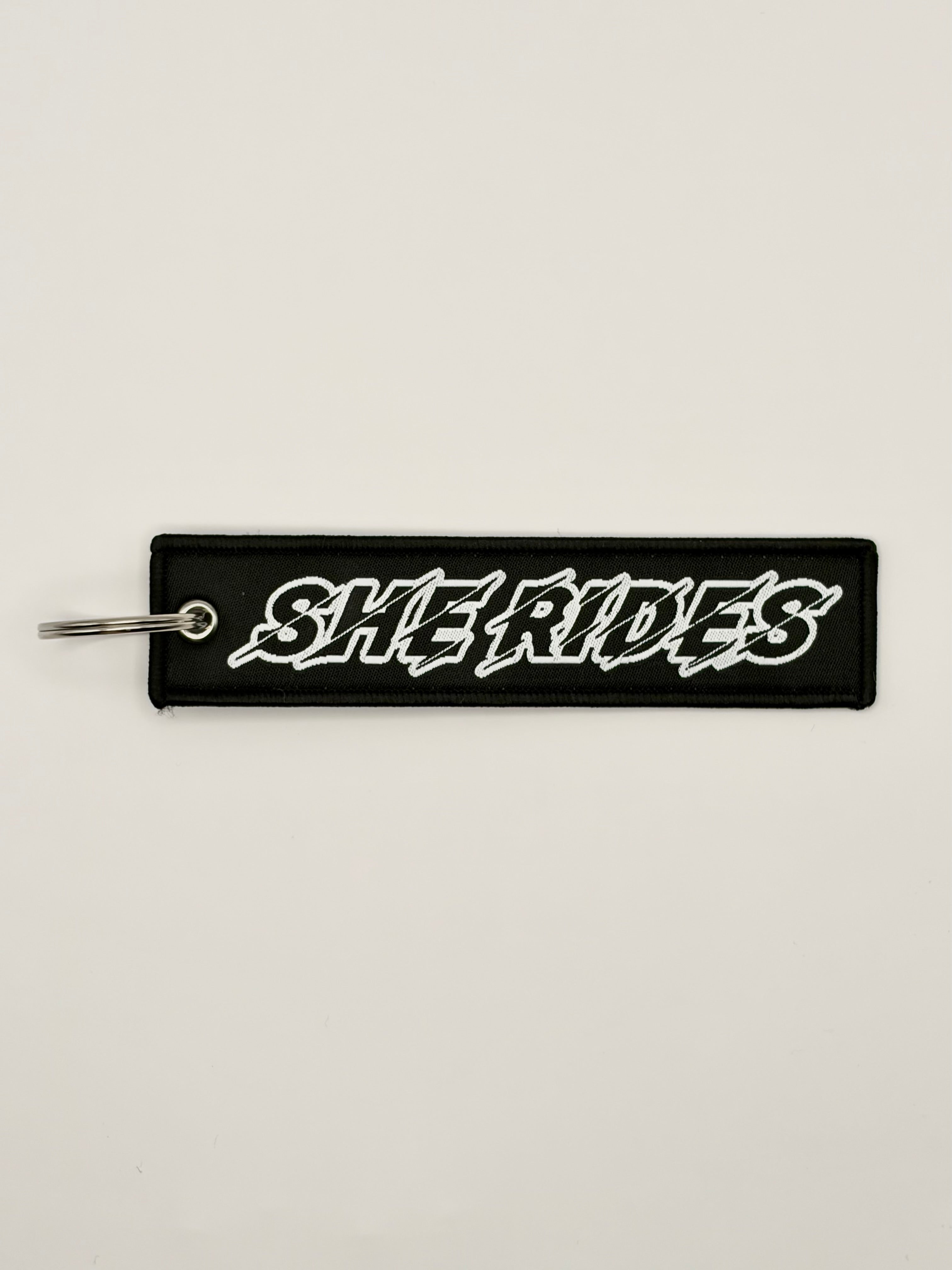 She Rides keychain wit